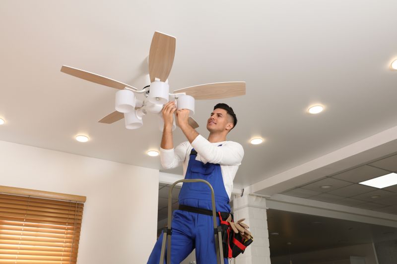 Handyman installing a ceiling fan